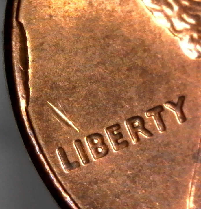 1957-D-Wheat-Penny-Die-Cud-On-Reverse